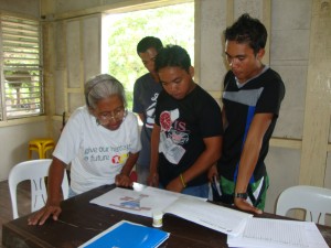 Teachers of Tagbanua learners check the curriculum development process shown in the ECE curriculum draft
