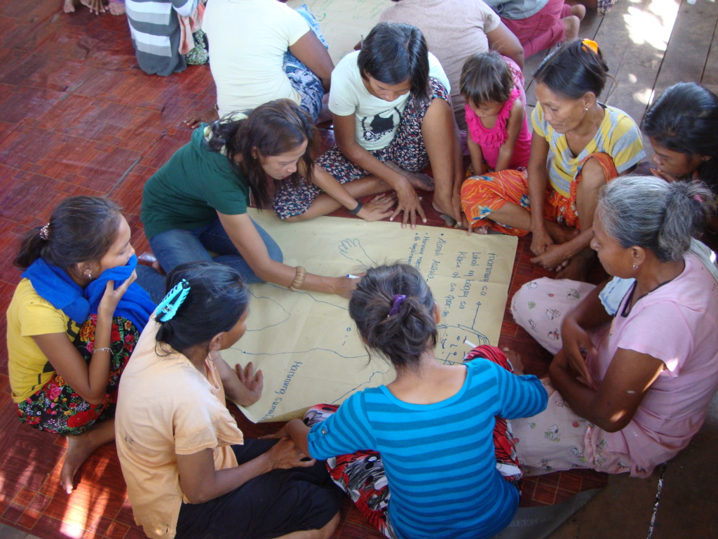 Teacher Relinda guides community members as they share their thoughts on the characteristics of an ideal Bajau student 
