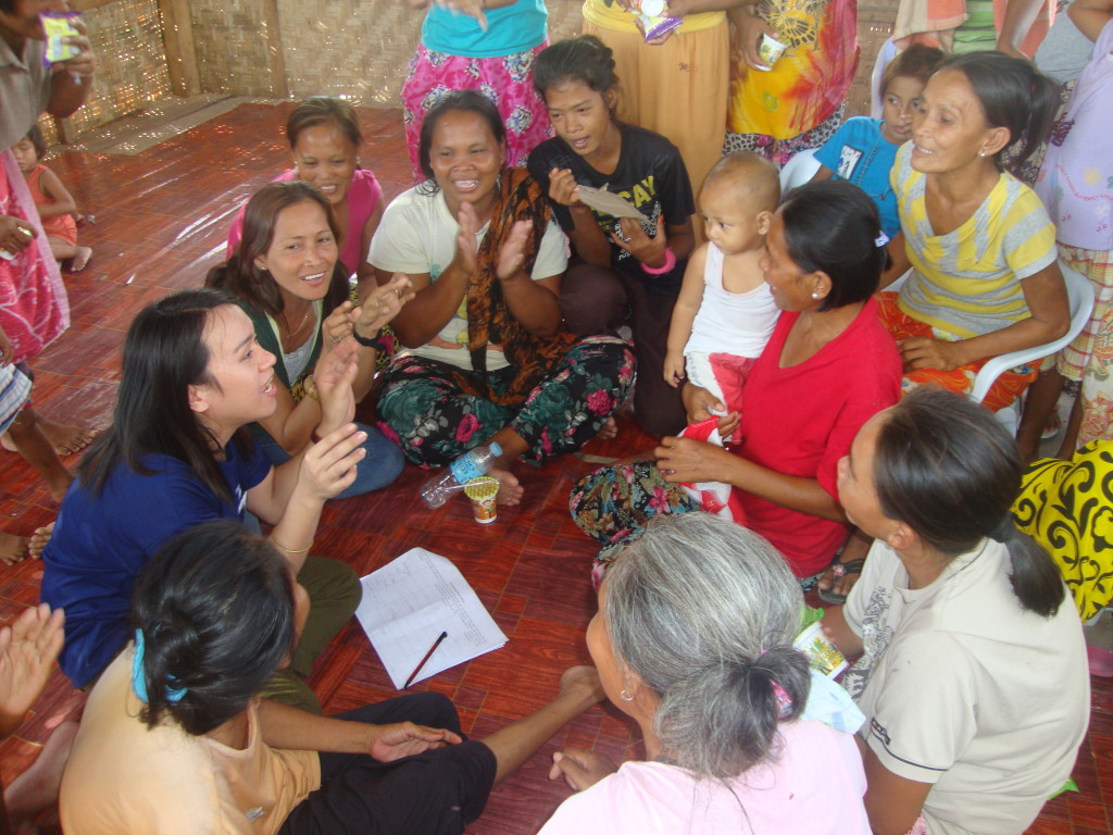 Bricks (leftmost, in blue) animatedly conducts a profiling interview with Bajau community members as respondents; Teacher Relinda remains by his side to help with translation