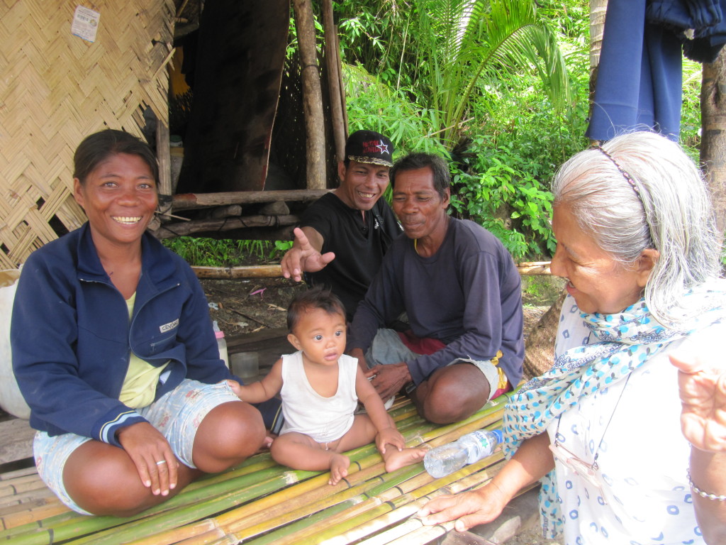 The family of Gina (leftmost) and Roberto Calix (second from right) in their home in Sitio Alulad is one among those visited and interviewed by workshop participants Teacher Lilia Diaz (rightmost) and Kagawad Enrico Pondevilla (third from right)