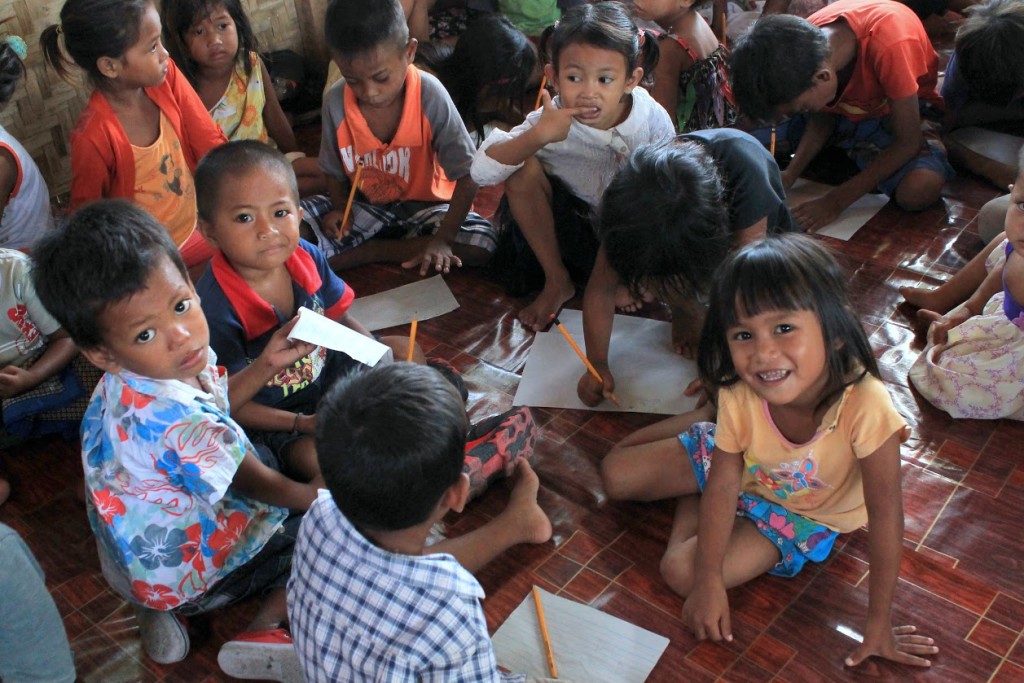 Bajau learners are comfortable doing school work on the floor – where they can easily move around and gather in small groups