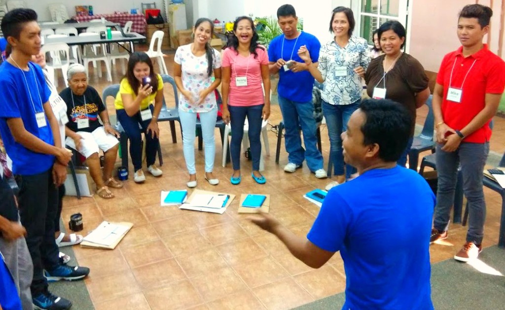 Charbee Gugma, Tagbanua from Culion, Palawan, leads the group in an interactive activity with song and movement. 