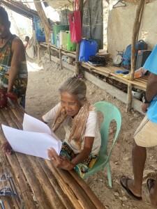 Bae Adelina Bering, a Culture-Bearer and narrator of one of the stories, reacts upon seeing the illustrations for the first time